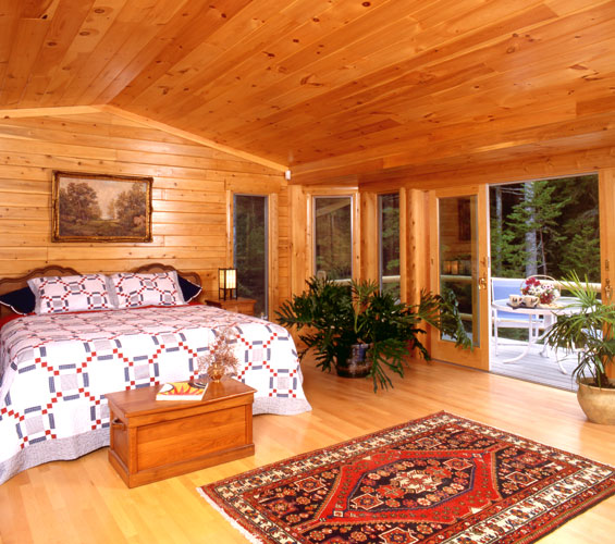 Large bedroom with sliding doors to deck